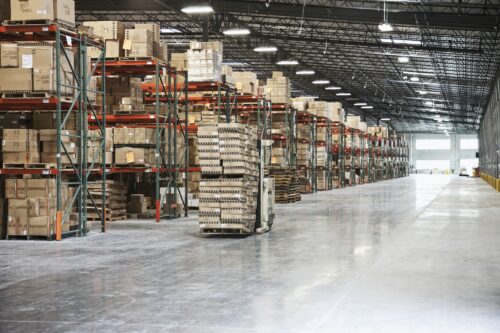 Cardboard boxes on shelves in warehouse